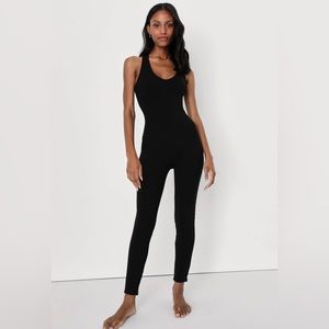NWT “Relaxing Reality” Black ribbed knit cross-back jumpsuit